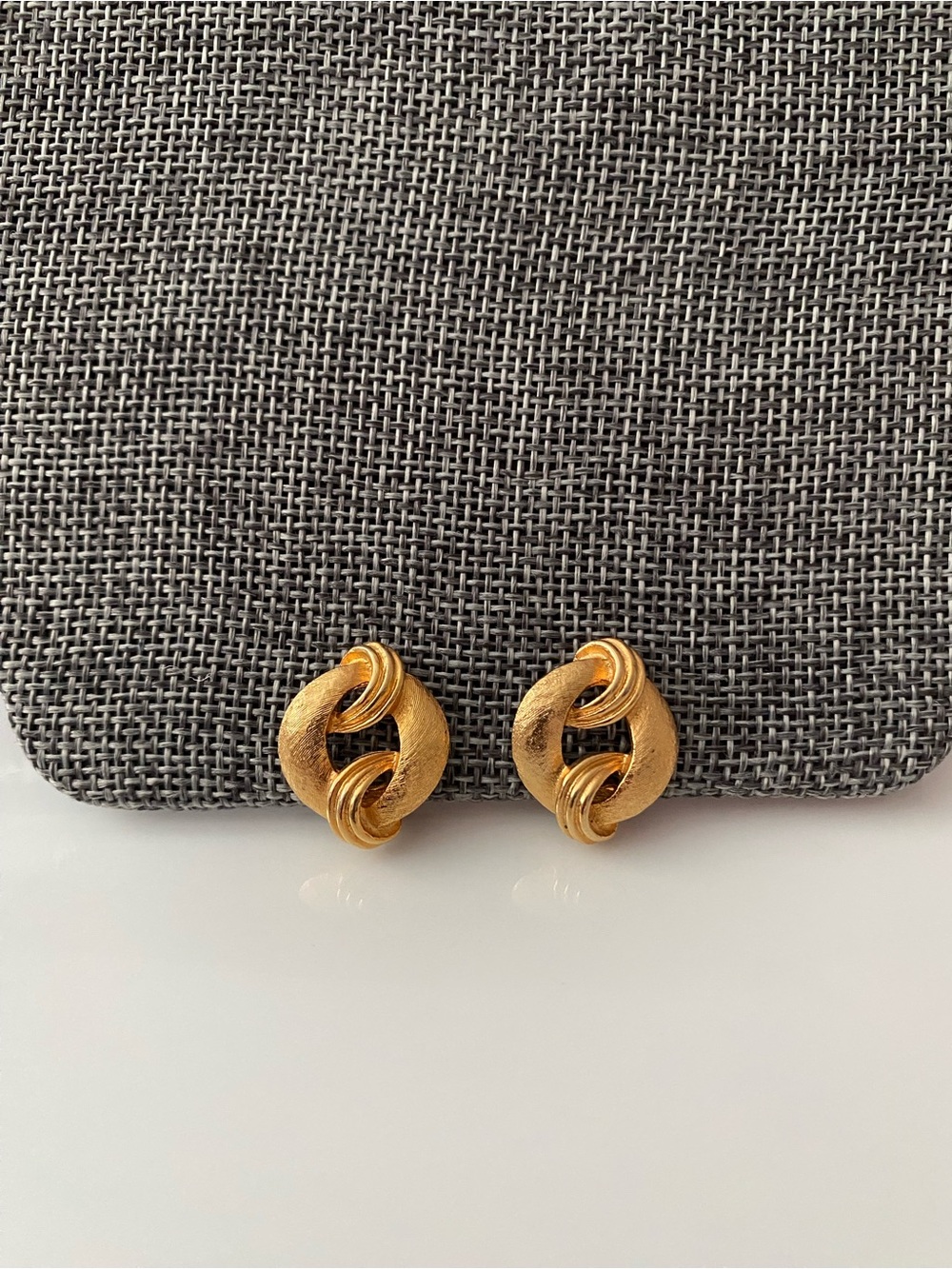 Vintage Corocraft gold-tone textured clip-on earrings.
